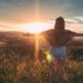 Person standing outdoors at sunset, representing workplace wellbeing sessions and short courses in Australia.