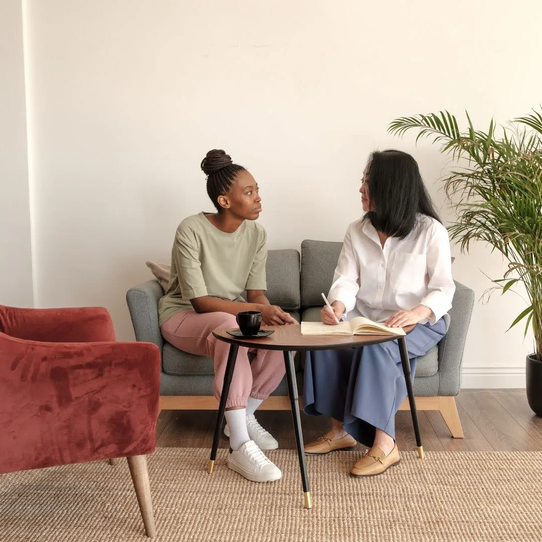 Two people in a supportive one-to-one conversation, relevant to Accidental Counsellor training in Australia.