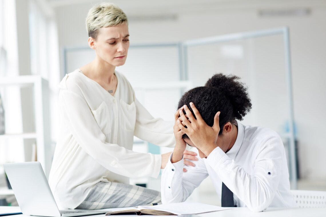 Colleague offering support during a difficult workplace conversation, relevant to Accidental Counsellor training in Australia.