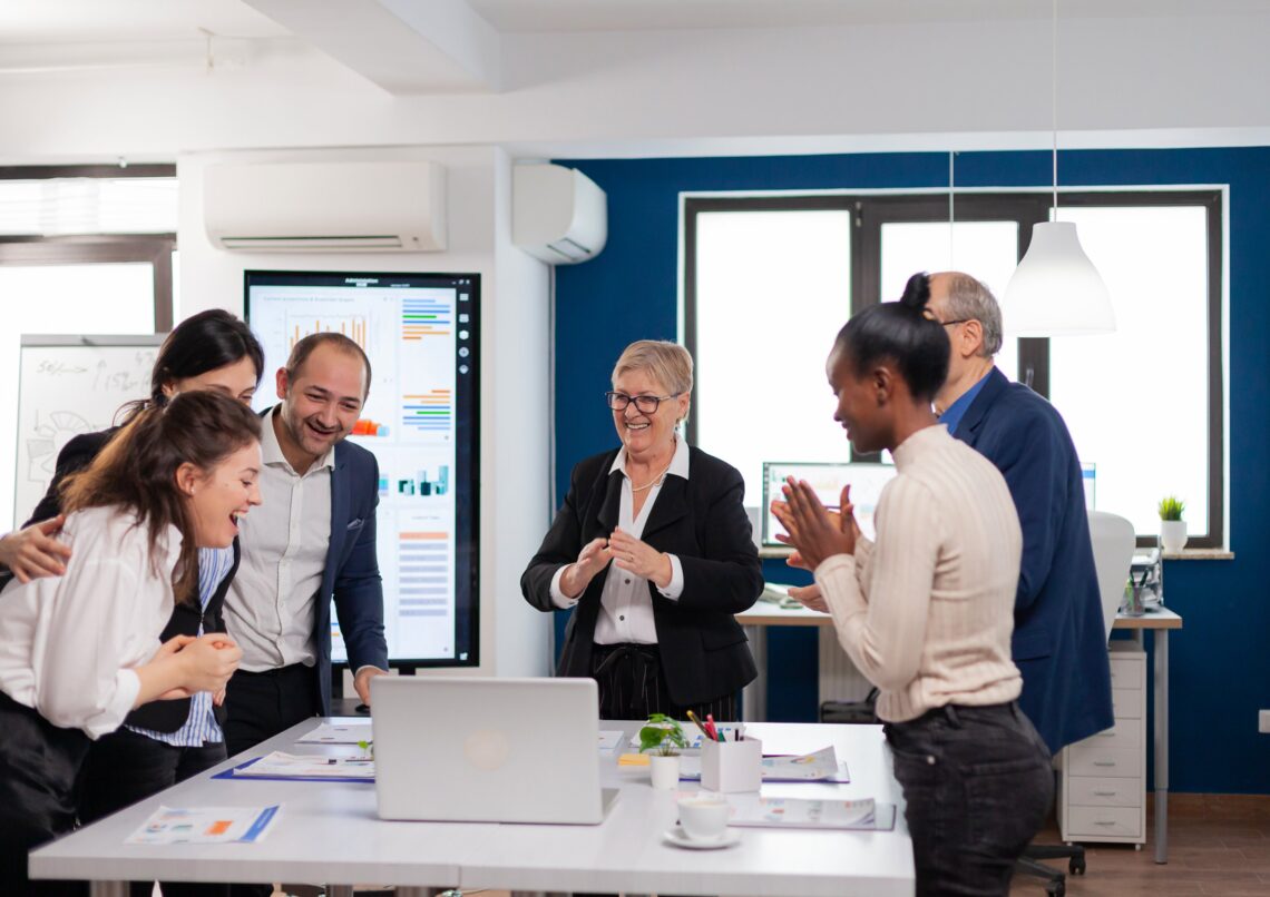 Diverse workplace team in a meeting room, representing Standard Mental Health First Aid training for employees and teams in Australia.